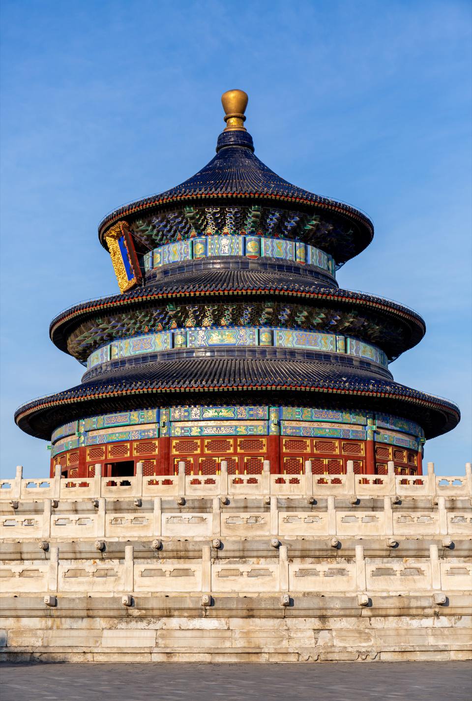 The Hall of Prayer for Good Harvests at the Temple of Heaven, its three blue-tiled roofs rising above a white marble terrace.